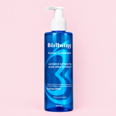 A 200 ml bottle of Birdwing Facial Cleanser with a white pump dispenser, featuring blue and white text on a translucent blue bottle, set against a solid light pink background.