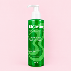 A 200 ml pump bottle of Birdwing Facial Cleanser Gel, featuring a translucent green bottle and a white pump dispenser, set against a solid light pink background.
