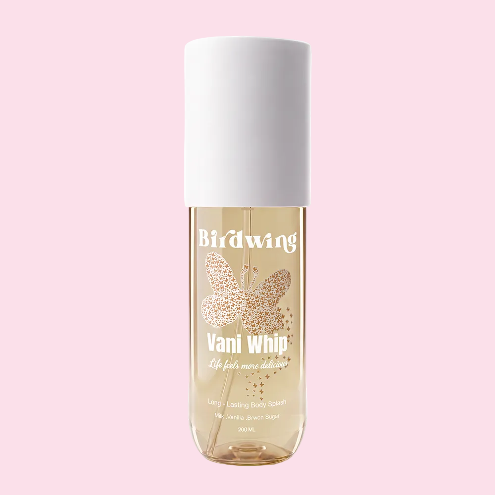 A 300 mL bottle of Birdwing Vani Whip lasting body spray, featuring a white cylindrical cap and a clear glass bottle showing a light golden-amber liquid inside. The label displays a butterfly pattern with gold glitter details and white text.